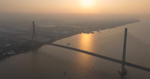 Time lapse of aerial view traffic in sunrise of the suspension bridge