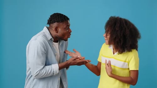 Couple Arguing and Using Hand Gestures in Studio