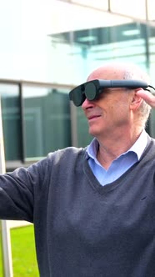 Man Uses Futuristic Eyewear in City Setting