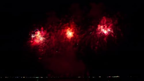 Loop seamless of real fireworks light up the sky with dazzling display in the night sky. 4KDCI