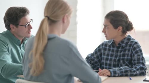 Team Discussing Project at Office Workplace