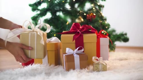 Christmas Presents Under Decorated Tree With Holiday Lights