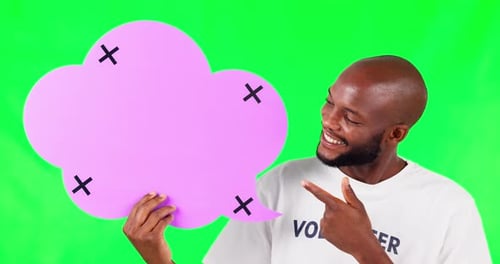 Speech bubble, mock up and a black man volunteer on green screen in studio for social media