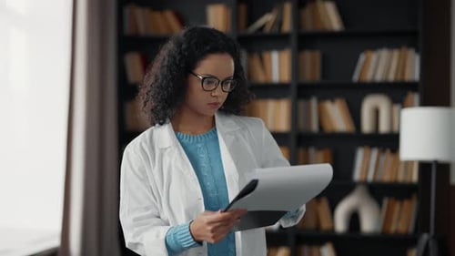 Young Woman Doctor in Hospital Office Serious Medical Student Girl Wearing White Medical Coat Look
