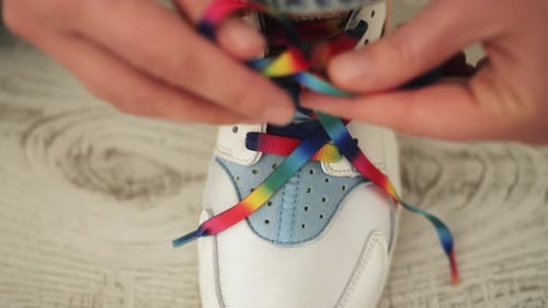 Close Up of Hands Tying Shoe Laces