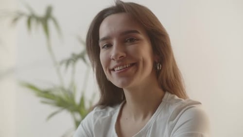 Smiling Young Woman Close-Up Indoors