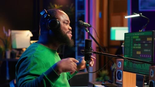 Confident Songwriter Performing a Tune on Microphone in Home Studio