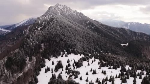 Aerial View of the Winter Landscape of the Wild Carpathians Rotating Shot of a Rocky Peak