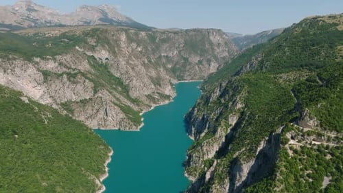 Drone view of the blue Piva Lake in the mountains of Montenegro