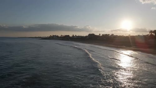 Aerial view of the coastline at sunset in Avola, Syracuse, Sicily, Italy.