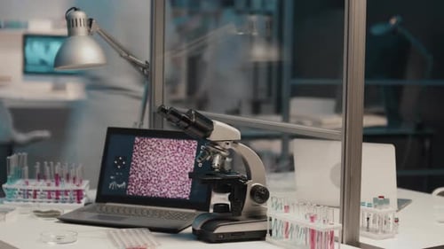 Laboratory Microscope and Laptop Science Research