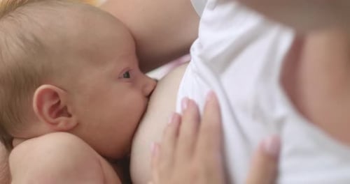Newborn Breastfeeding with Love and Affection Indoors