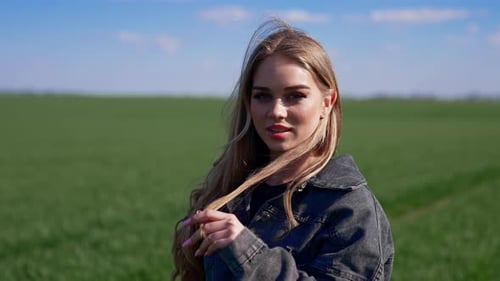 Beautiful Woman in Field on Sunny Day
