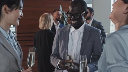 Young Co-workers Laughing At Something