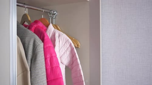 Jackets Hanging in Closet Interior