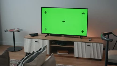 Green Screen TV on Sleek Console in Cozy Living Room