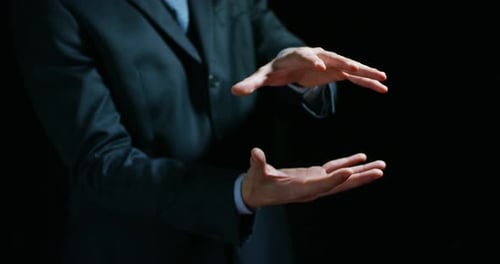 Adult Wearing Suit Holding Hands Outward