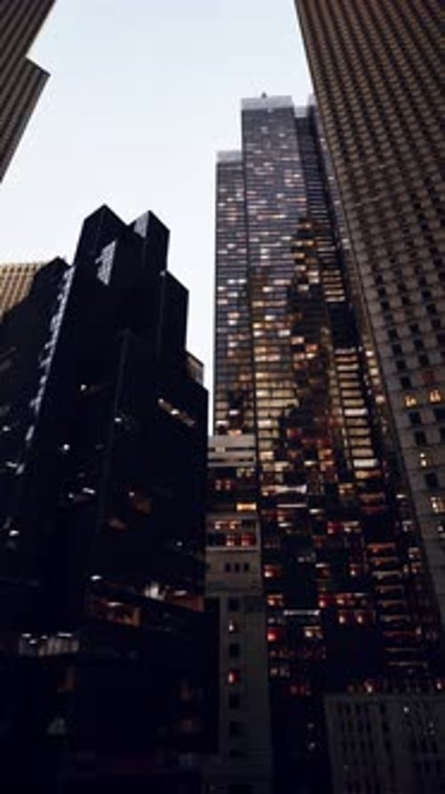 Tall Buildings in City Night