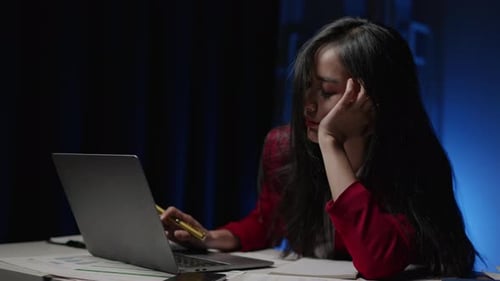 Businesswoman is seriously stressed working overtime bored and burnout due to office syndrome