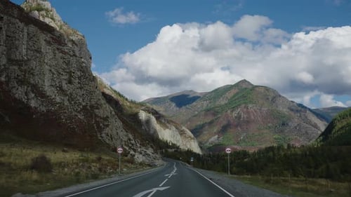 Traveling By Car Firstperson View of the Road and the Mountain Landscape Ahead