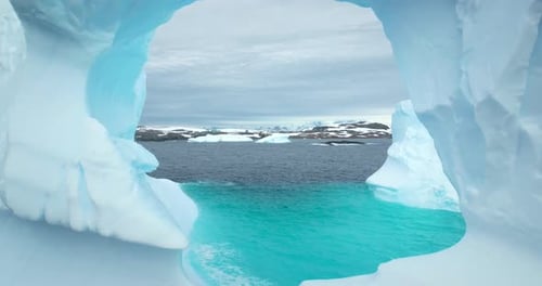 Huge Hole in Melting Iceberg in Antarctic Ocean