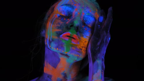 A Girl's Face with an Ultraviolet Pattern in the Light of a Fluorescent Lamp