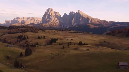 Drone Flying Away from Seiser Alm Alpine Meadow at Sunset. Amazing Landscape in the Italian Dolomite