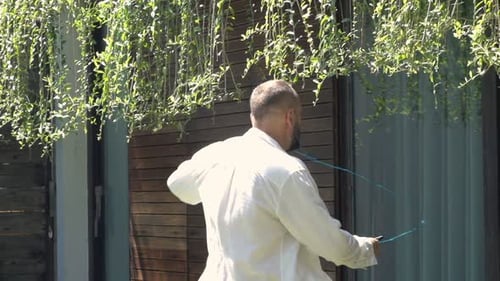 Young Man Listening to Music and Dancing in Garden, Super