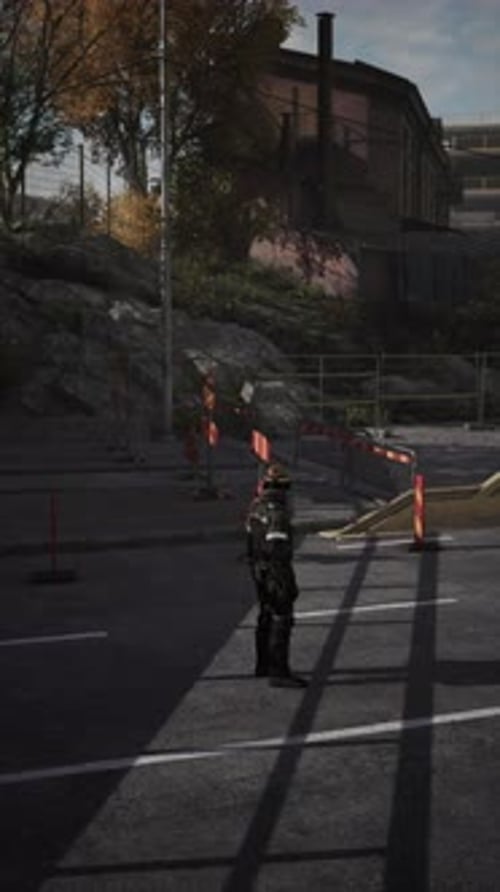 Road Worker Supervising Traffic and Construction Site During Afternoon Light