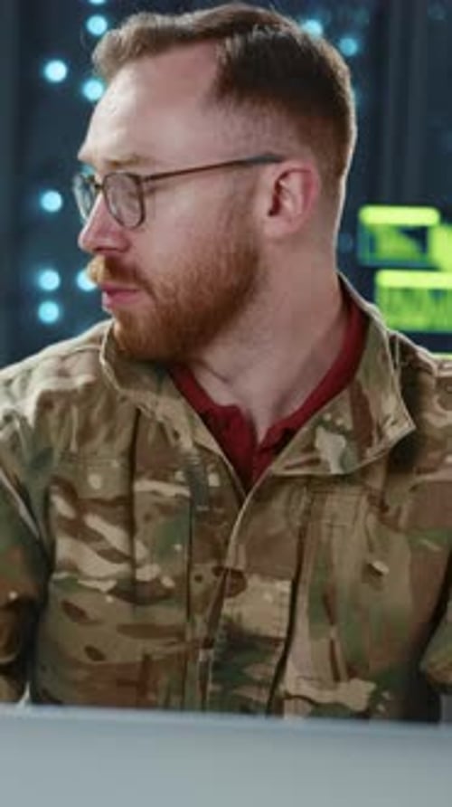 Military Man in Camouflage Browsing Computer for Cyber Security Secret Operations Couple of Officers