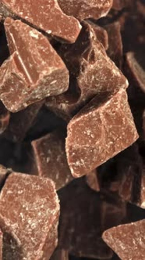 Super Slow Motion Pieces of Dark Milk Chocolate Filmed on a Highspeed Camera at 1000 Fps