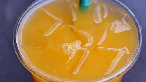 Refreshing Cold Drink with Ice and Straw Close-Up