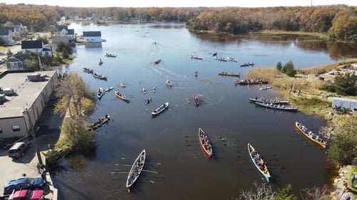 Aerial high altitude footage of teams of canoe racers waiting to start race. Drone Static
