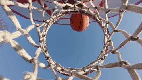 Outdoor Basketball Shot Flying Into Hoop Scoring A Point On Park Court