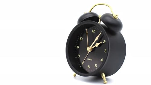Black Analog Alarm Clock With Gold Accents