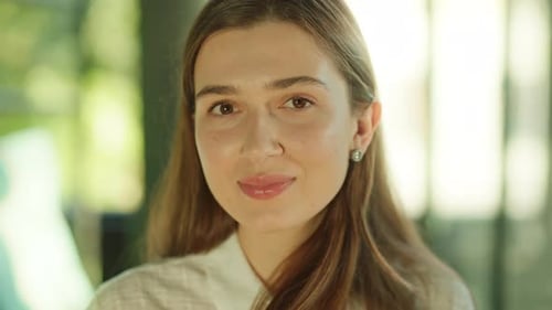 Woman Smiles in Bright Close Up Portrait