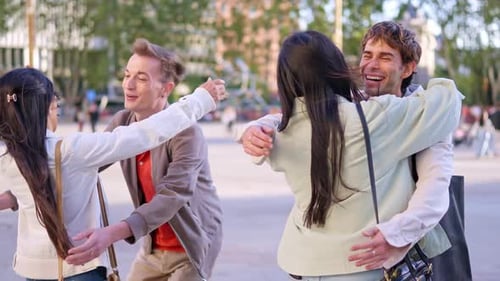Happy Young Couples Hugging and Smiling in the Park