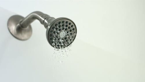 Shower Head Sprays Water in Bathroom