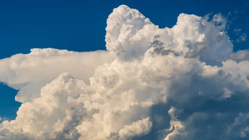 Fluffy White Clouds Against a Vibrant Blue Sky