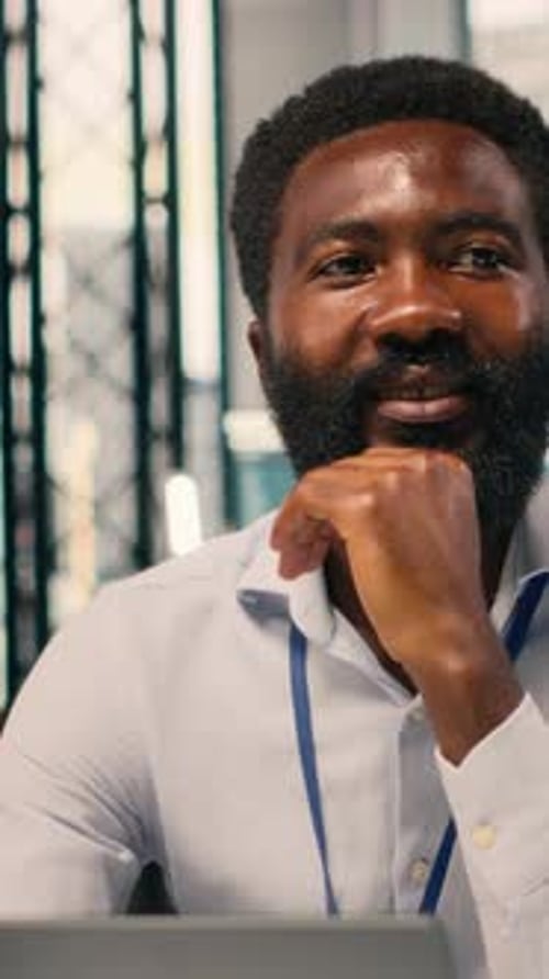 Vertical Video Portrait of African American Businessman Analyzing KPI Metrics and Insights