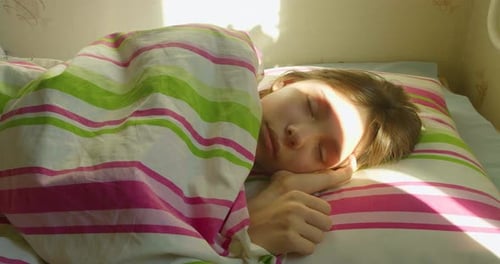 Young Adult Sleeping Peacefully in Bed at Home