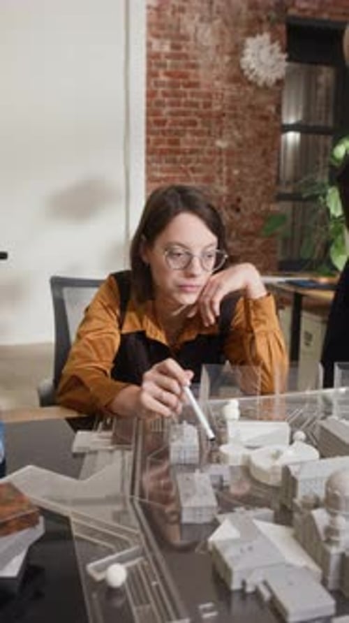 Architects Working on Architectural Model of Urban Complex