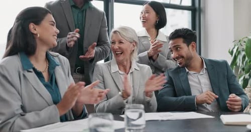 Team of Professionals Applauding in Modern Office