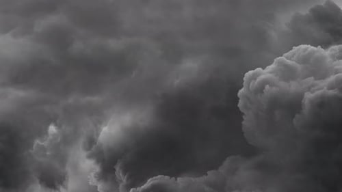 view of towards storm clouds and flashes of lightning.