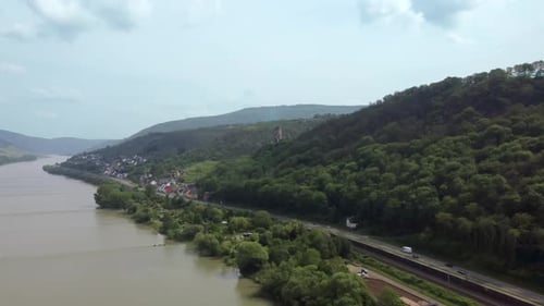 Railway and Traffic on riverside road along Rhine and hillside german villages, Gailsbach