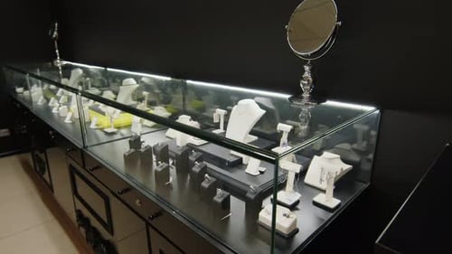 Fine Jewellery Pieces Dispayed in Elegant Glass Showcase in Elite Shop
