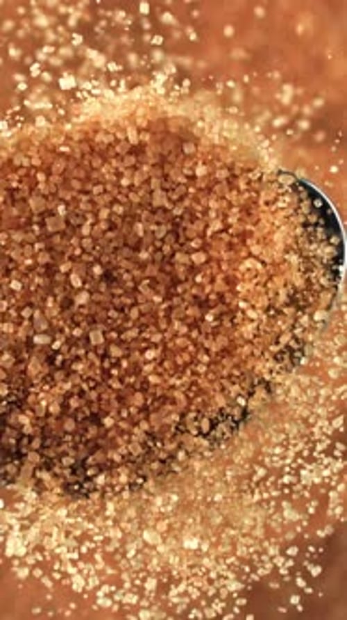 Cane Sugar Pours Out of a Spoon Filmed on a Highspeed Camera at 1000 Fps