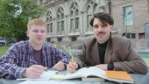 Male College Students Posing for Camera Outdoors on Campus