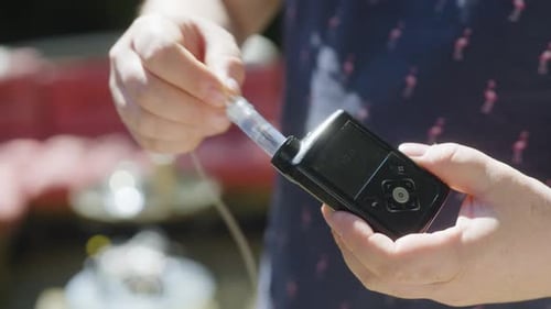 Hand Holding Insulin Pump Controller for Diabetes