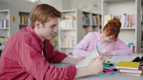 Redhead Guy and Girl Talk Searching Information for Report
